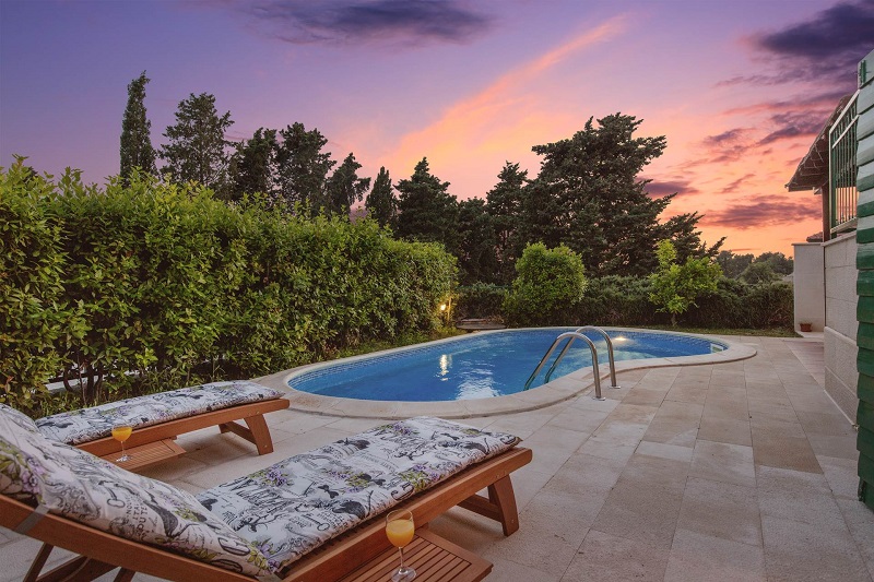 Sun lounges at the pool at night