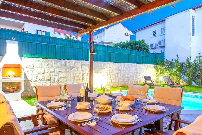 Dining table and fire place in the garden