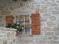 Wooden shutters on villa Kata