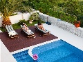 Pool with sun lounges