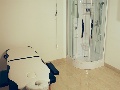 Wellness with shower and massage table