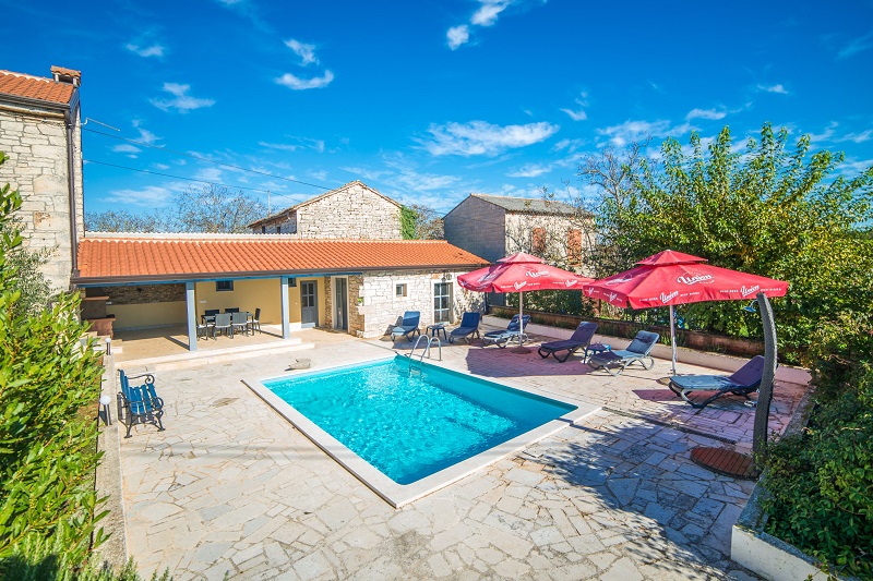 Pool with sun lounges