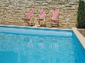 Swimming pool with sun lounges