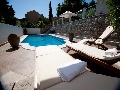 Pool with sun lounges