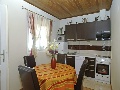 Kitchen and dining in apartment Ruzmarin
