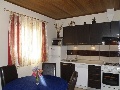 Kitchen and dining in apartment Ruzmarin