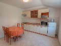 Kitchen and dining room in the apartment on the upper floor