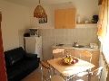 Kitchen with dining table and sofa