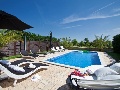 Pool with sun lounges