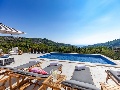 Pool with sun lounges and stunning view
