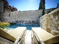 Pool with sun lounges