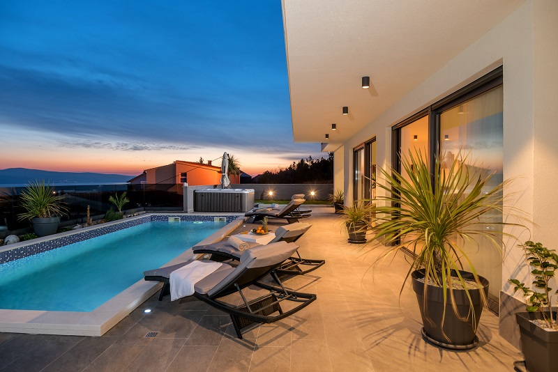 Pool with sun lounges