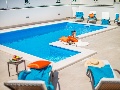 Swimming pool and sun lounges