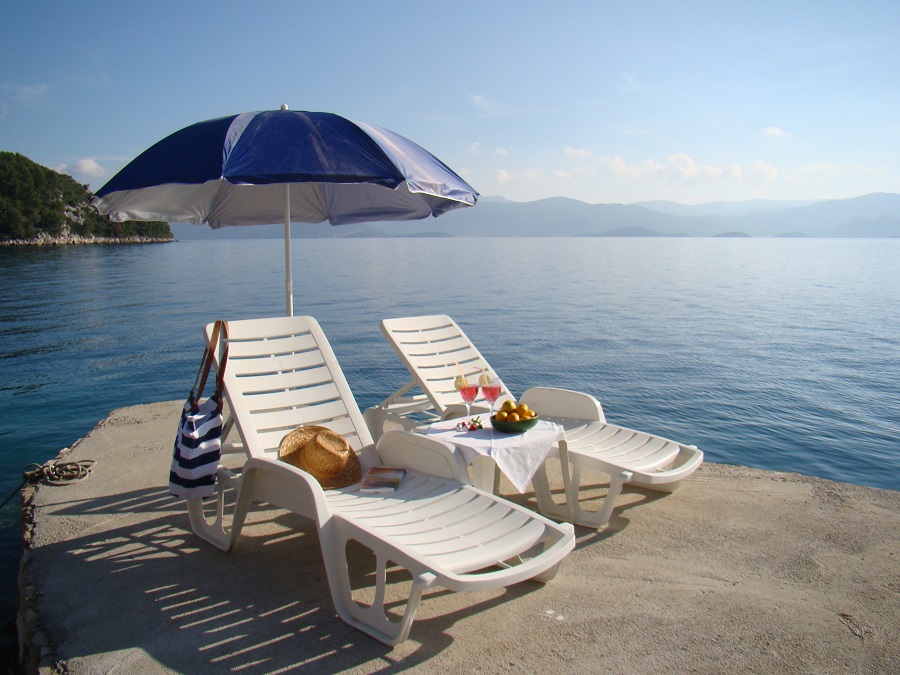 Deck chairs on the private beach