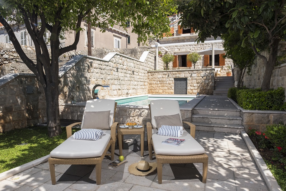 Pool with sun lounges