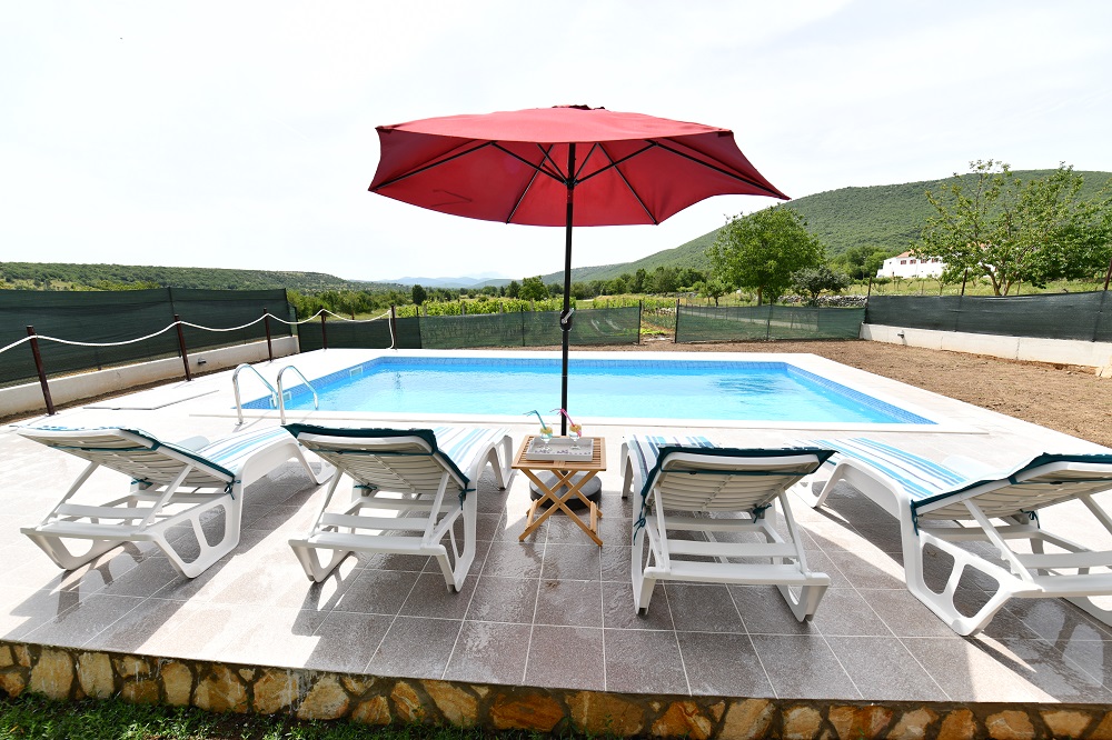 Pool with sun lounges