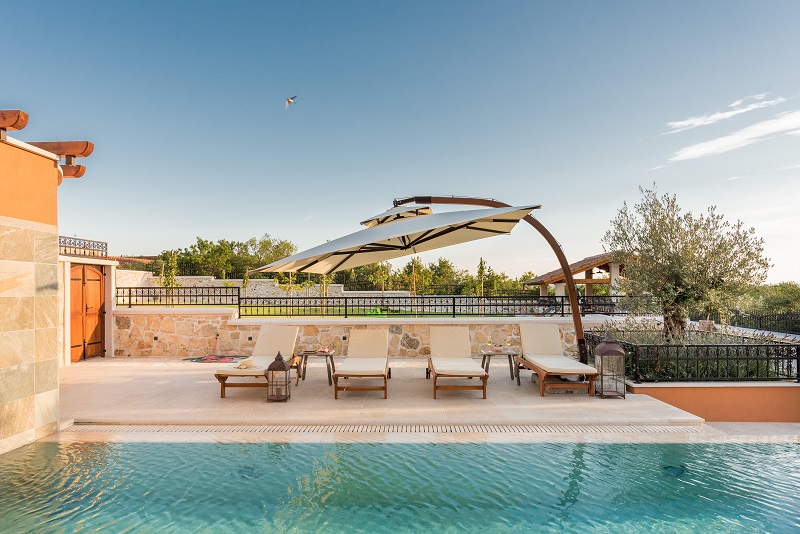 Pool with sun lounges