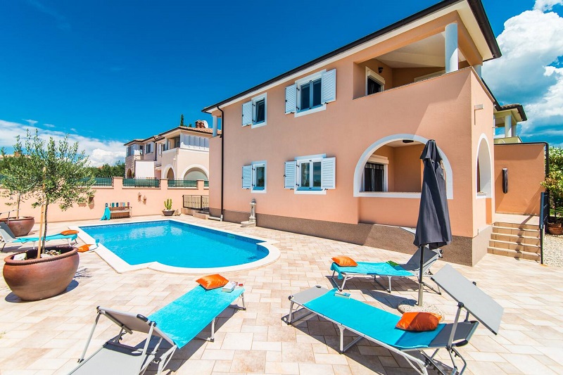 Pool with sun lounges