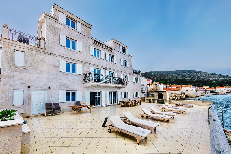 Sun lounges in front of the house